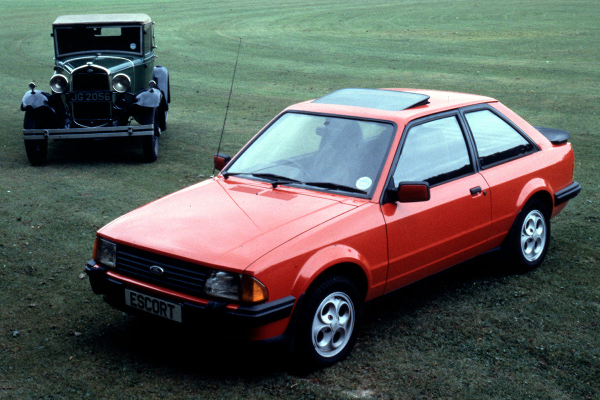 This archival image documents the 1981 Ford Escort Mark III XR3 with Model A (Millionth Escort) in scenic field and is preserved in the Ford Heritage Vault as part of Ford Motor Company's historic photographic archive. Free for personal, non-comme...