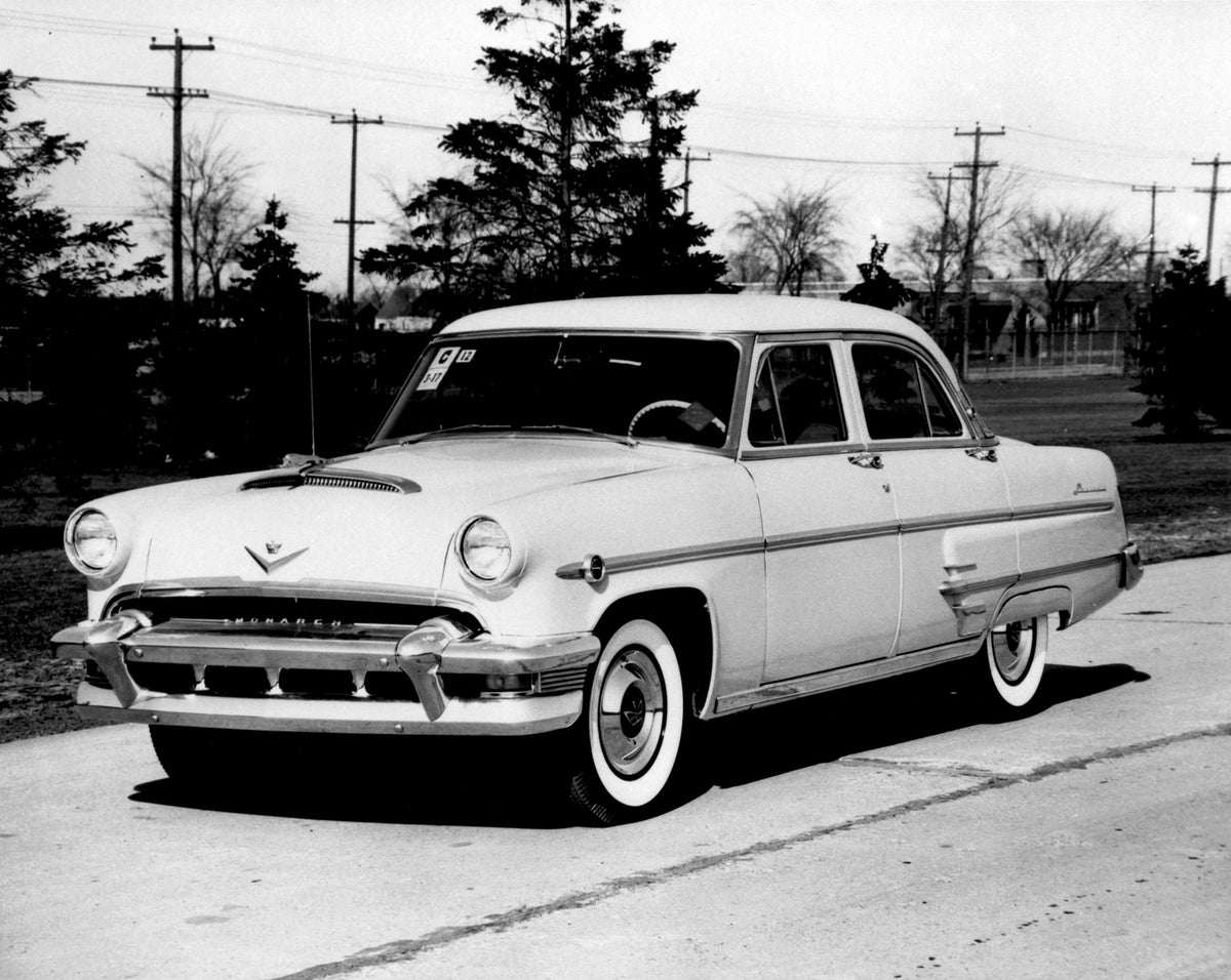 This archival image documents the 1954 Monarch Lucerne Sedan on scenic road with trees AR-2007-5 and is preserved in the Ford Heritage Vault as part of Ford Motor Company's historic photographic archive. Free for personal, non-commercial use. Ford...