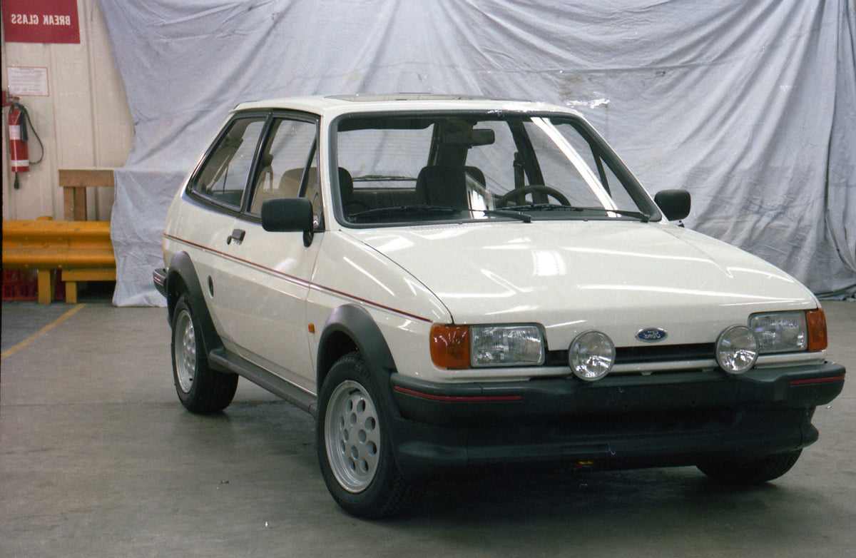 This archival image documents the 1986 Ford Fiesta Mark II XR2 in garage and is preserved in the Ford Heritage Vault as part of Ford Motor Company's historic photographic archive. Free for personal, non-commercial use. Ford Heritage Vault referenc...