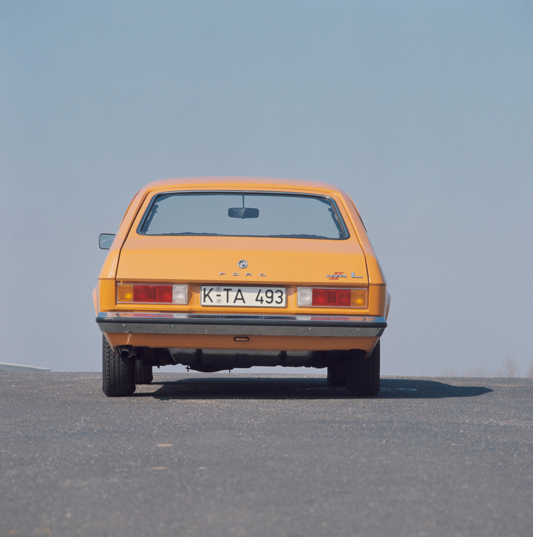 This archival image documents the 1976 Ford Capri II rear view with scenic blue sky and is preserved in the Ford Heritage Vault as part of Ford Motor Company's historic photographic archive. Free for personal, non-commercial use. Ford Heritage Vau...