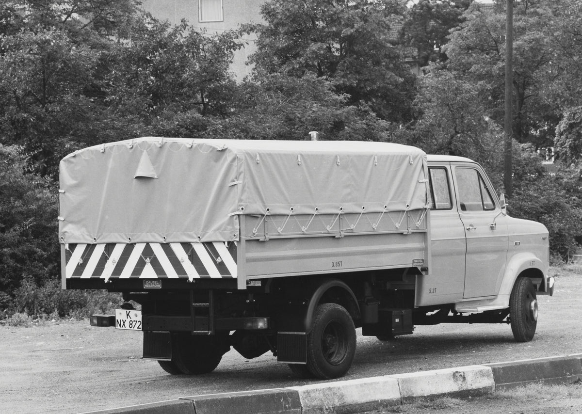 This archival image documents the 1970 Ford A-Series Truck rear view on dirt road with scenic trees and is preserved in the Ford Heritage Vault as part of Ford Motor Company's historic photographic archive. Free for personal, non-commercial use. F...