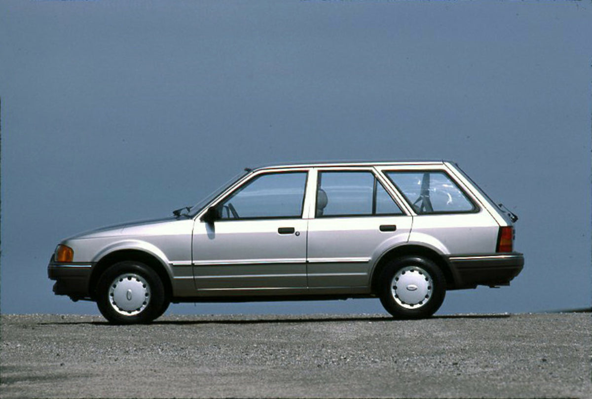 This archival image documents the 1986 Ford Escort Mark IV side view with scenic blue sky and is preserved in the Ford Heritage Vault as part of Ford Motor Company's historic photographic archive. Free for personal, non-commercial use. Ford Herita...