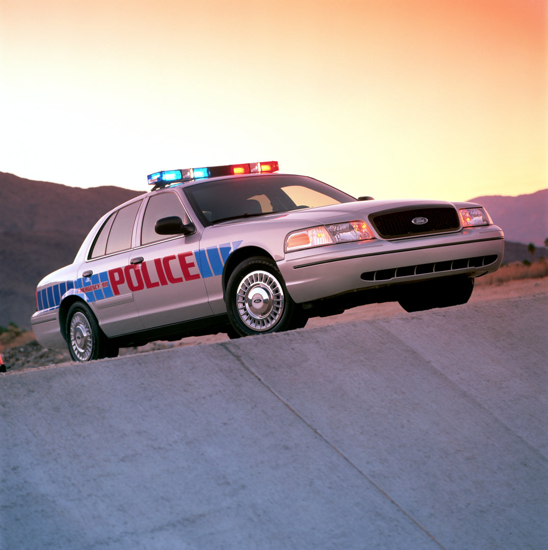 This archival image documents the 2003 Ford Crown Victoria Police Interceptor and is preserved in the Ford Heritage Vault as part of Ford Motor Company's historic photographic archive. Free for personal, non-commercial use. Ford Heritage Vault ref...
