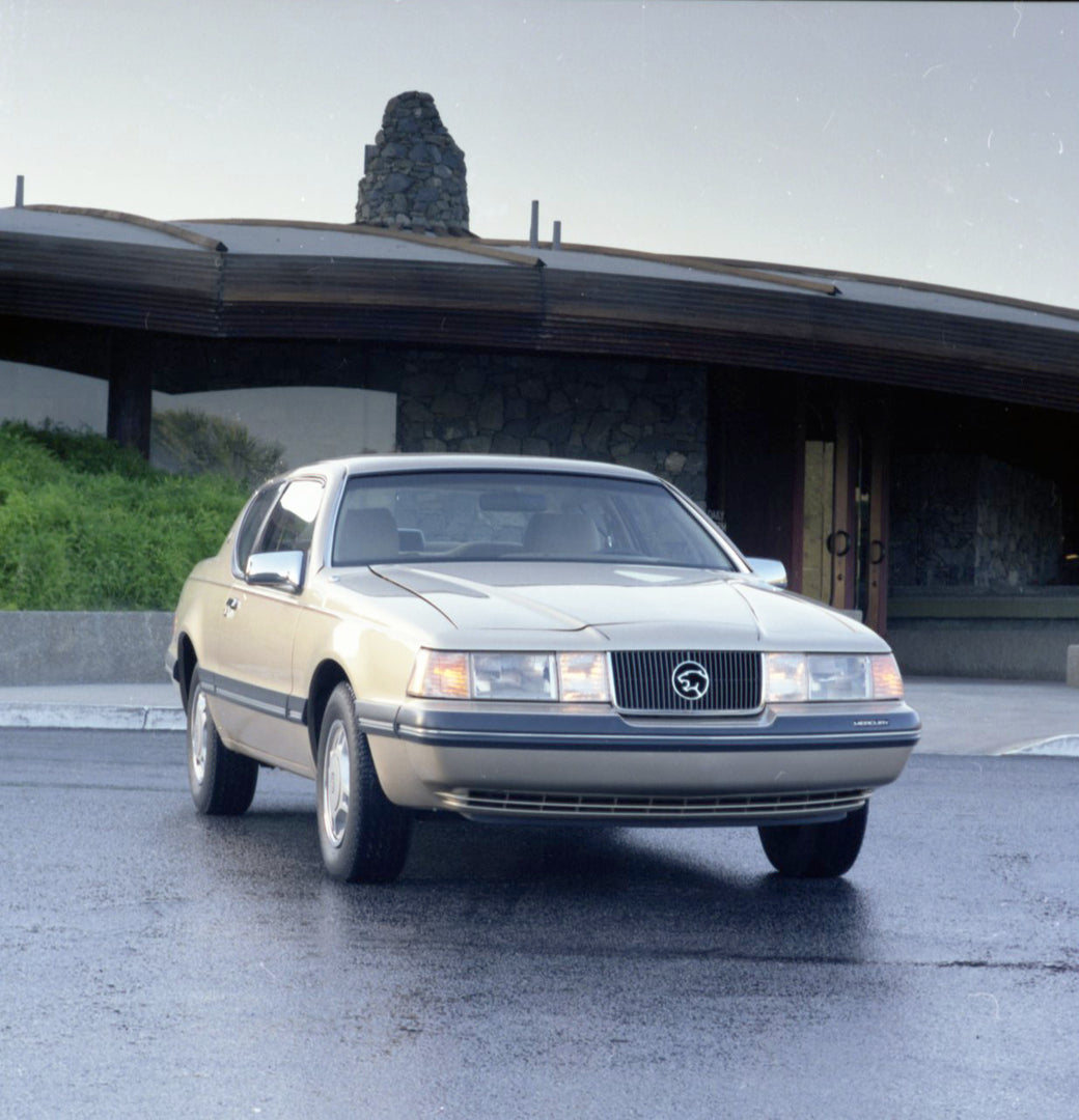 This archival image documents the 1987 Mercury Cougar front view in front of house CN45012-011003 and is preserved in the Ford Heritage Vault as part of Ford Motor Company's historic photographic archive. Free for personal, non-commercial use. For...