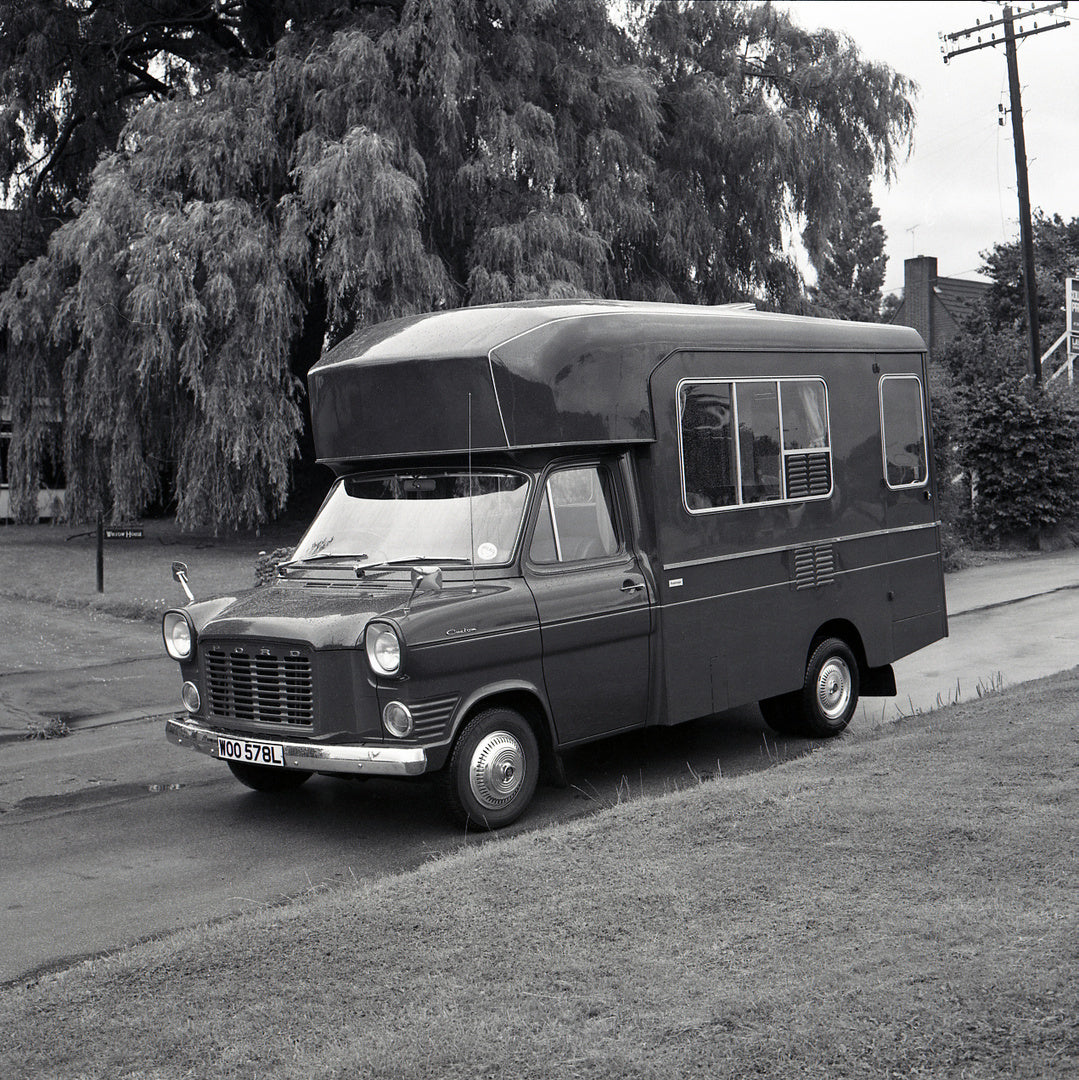 This archival image documents the 1973 Ford Transit Mark I Roadranger Motor Caravan on scenic street and is preserved in the Ford Heritage Vault as part of Ford Motor Company's historic photographic archive. Free for personal, non-commercial use. ...