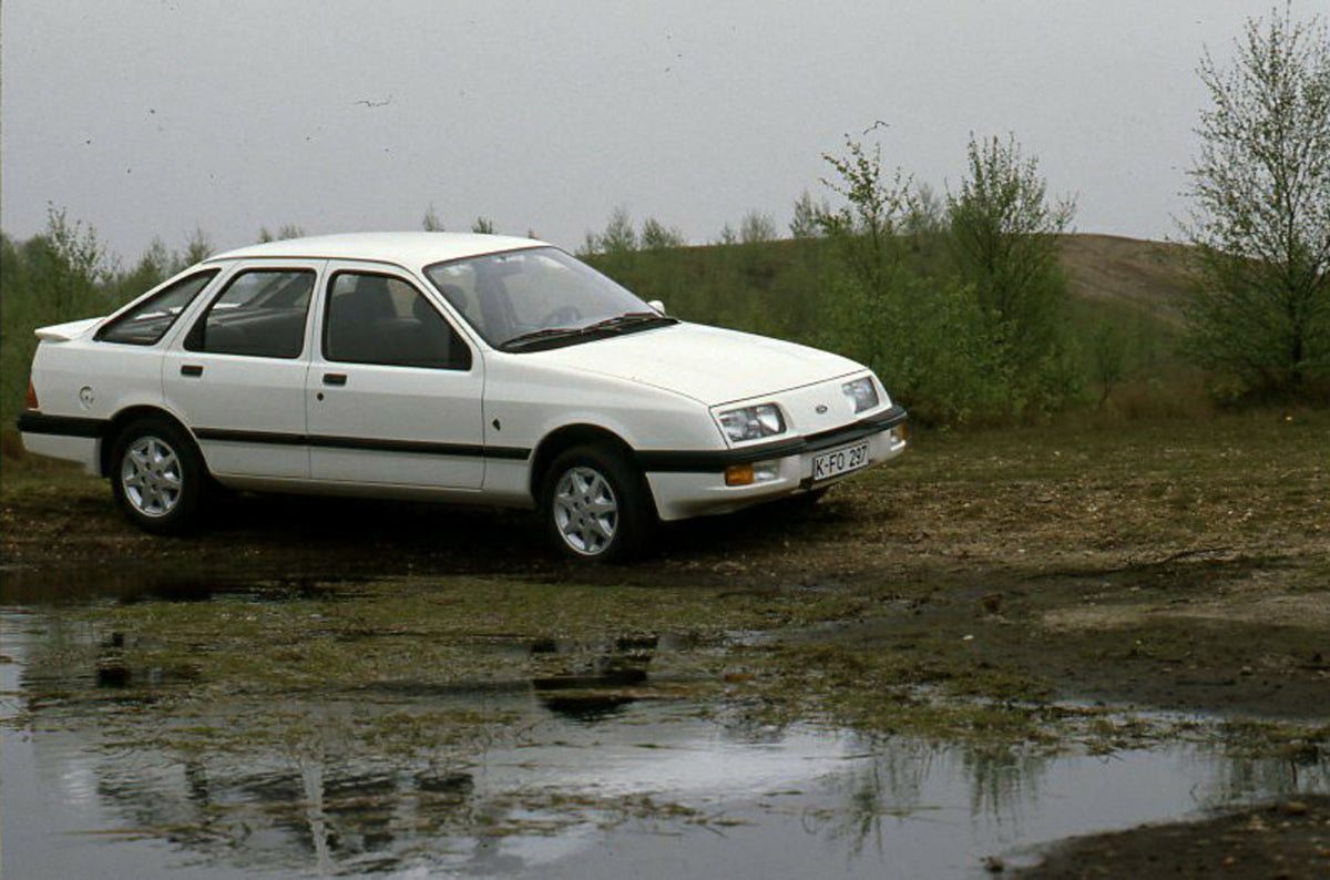 This archival image documents the 1985 Ford Sierra XR 4x4 LHD in scenic marshy area and is preserved in the Ford Heritage Vault as part of Ford Motor Company's historic photographic archive. Free for personal, non-commercial use. Ford Heritage Vau...