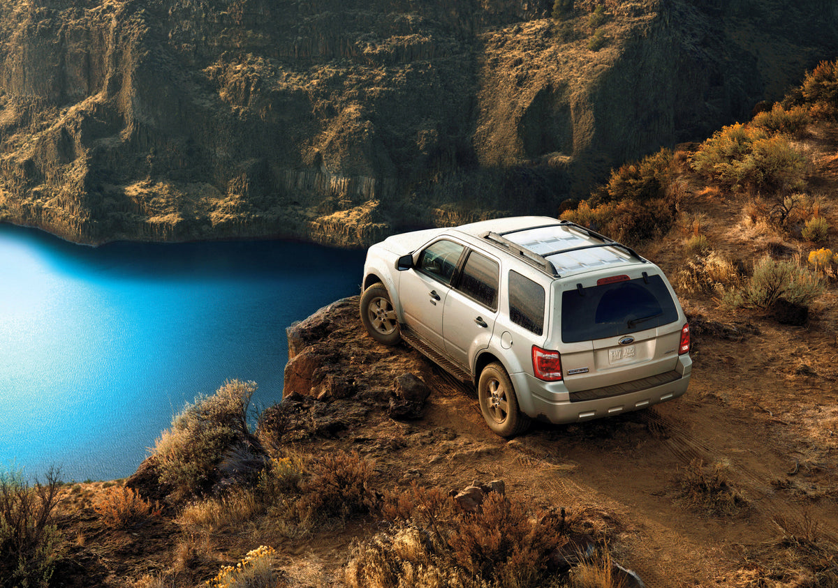 This archival image documents the 2009 Ford Escape on scenic cliff and is preserved in the Ford Heritage Vault as part of Ford Motor Company's historic photographic archive. Free for personal, non-commercial use. Ford Heritage Vault reference AR-2...