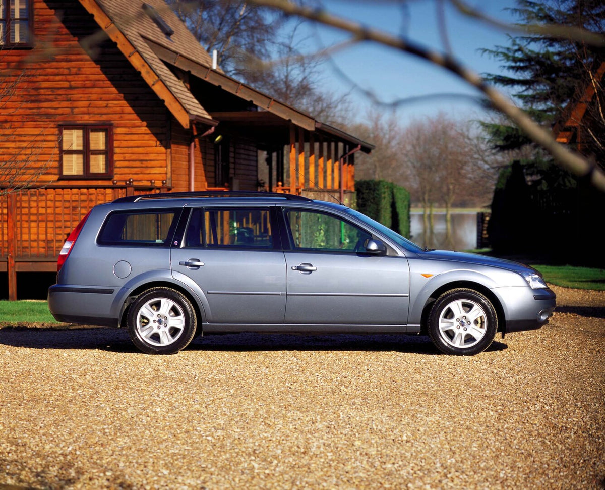 This archival image documents the 2002 Ford Mondeo Estate Mark II side view with scenic cabin and is preserved in the Ford Heritage Vault as part of Ford Motor Company's historic photographic archive. Free for personal, non-commercial use. Ford He...