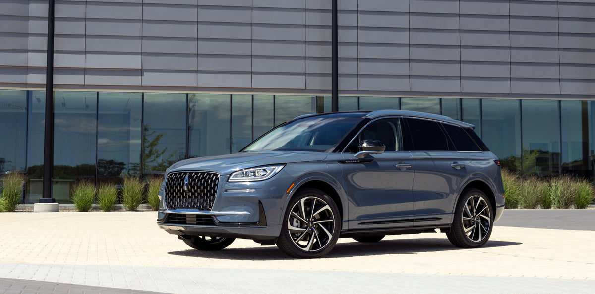 This archival image documents the 2023 Lincoln Corsair Grand Touring in front of building and is preserved in the Ford Heritage Vault as part of Ford Motor Company's historic photographic archive. Free for personal, non-commercial use. Ford Herita...