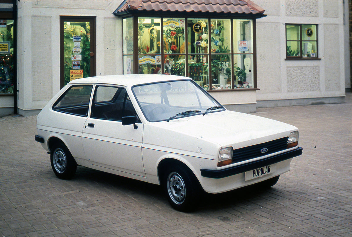 This archival image documents the 1981 Ford Fiesta Mark I Popular in front of storefront and is preserved in the Ford Heritage Vault as part of Ford Motor Company's historic photographic archive. Free for personal, non-commercial use. Ford Heritag...