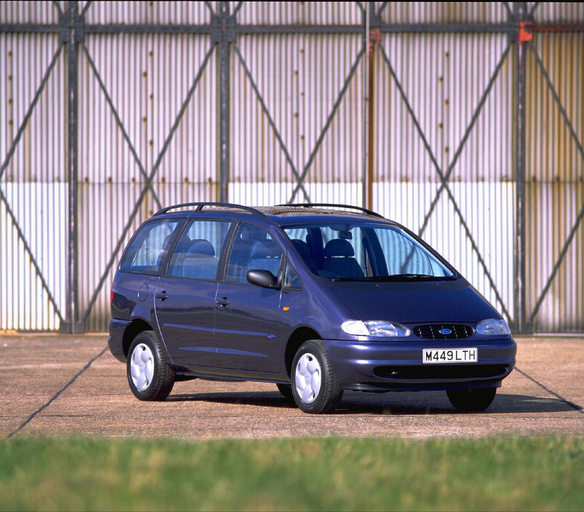 This archival image documents the 1994 Ford Galaxy Mark I GLX in front of scenic wall AR-2002-213709 and is preserved in the Ford Heritage Vault as part of Ford Motor Company's historic photographic archive. Free for personal, non-commercial use. ...