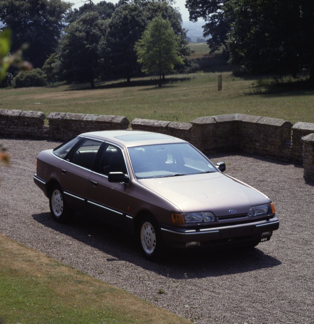 This archival image documents the 1989 Ford Granada Scorpio Mark III on scenic road and is preserved in the Ford Heritage Vault as part of Ford Motor Company's historic photographic archive. Free for personal, non-commercial use. Ford Heritage Vau...