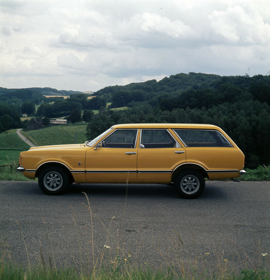 This archival image documents the 1974 Ford Taunus Estate GXL side view on scenic road and is preserved in the Ford Heritage Vault as part of Ford Motor Company's historic photographic archive. Free for personal, non-commercial use. Ford Heritage ...