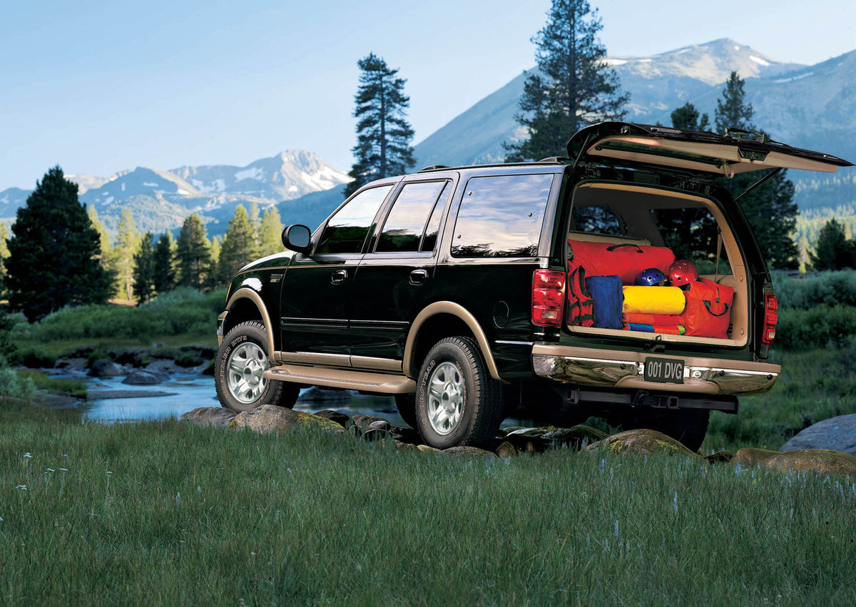 This archival image documents the 2002 Ford Expedition rear view in scenic mountains with equipment in trunk MS71409 and is preserved in the Ford Heritage Vault as part of Ford Motor Company's historic photographic archive. Free for personal, non-...