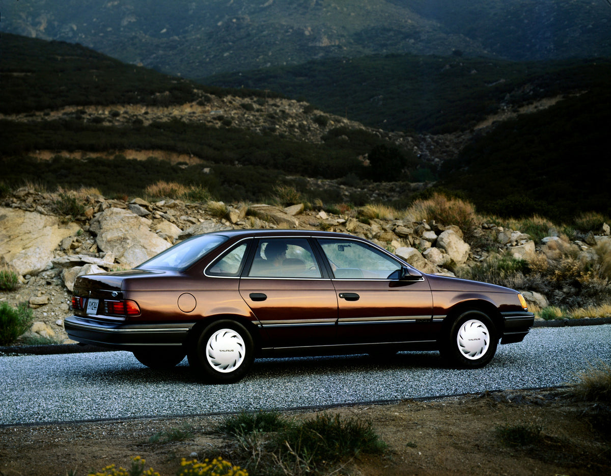This archival image documents the 1990 Ford Taurus four-door and is preserved in the Ford Heritage Vault as part of Ford Motor Company's historic photographic archive. Free for personal, non-commercial use. Ford Heritage Vault reference AR-2001-94...