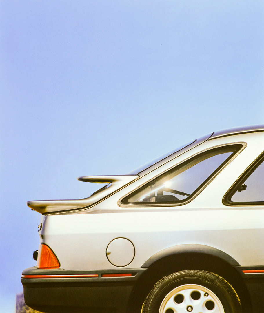 This archival image documents the 1986 Merkur XR4Ti tail end and is preserved in the Ford Heritage Vault as part of Ford Motor Company's historic photographic archive. Free for personal, non-commercial use. Ford Heritage Vault reference AR-2001-89...