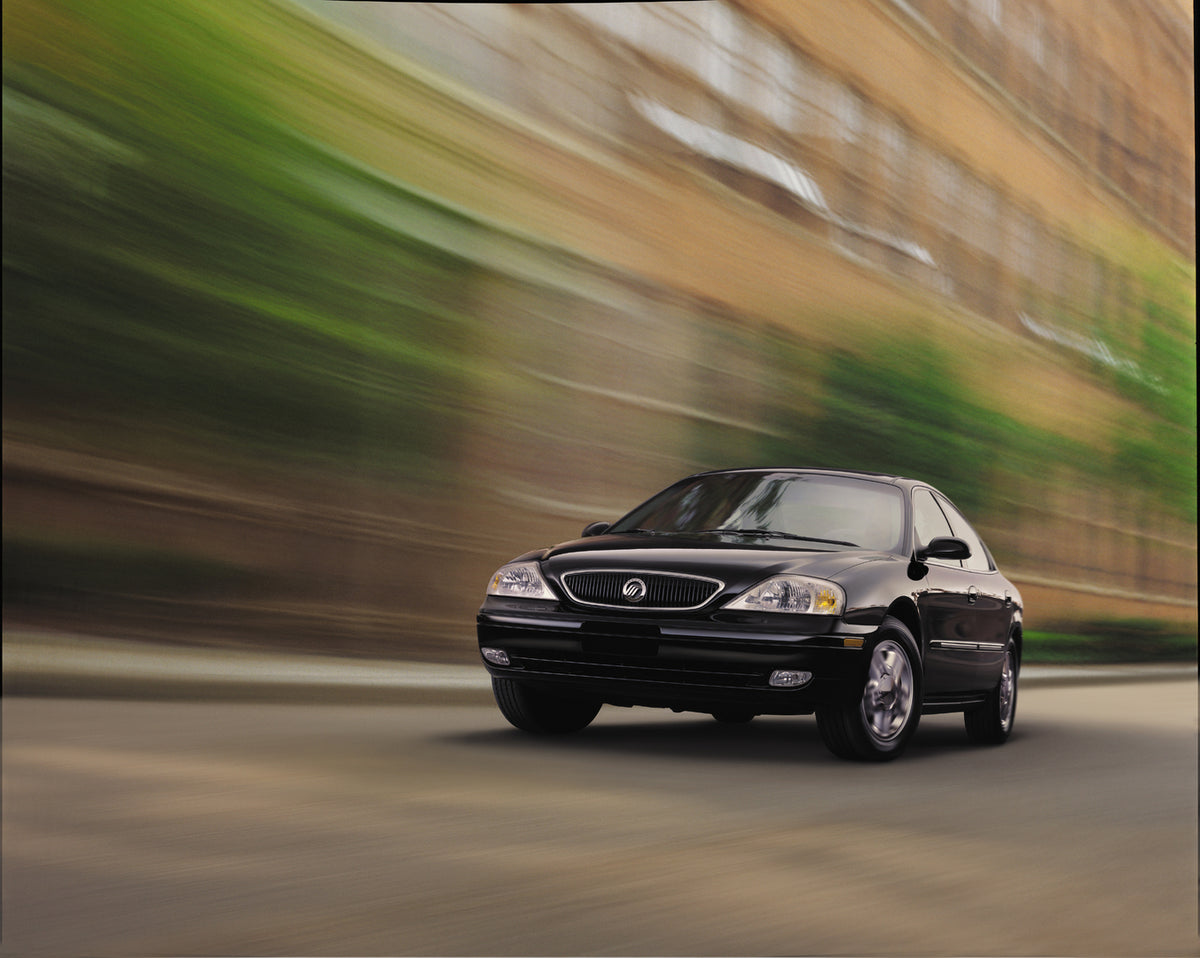 This archival image documents the 1999 Mercury Sable with Green and Brown Blurred Background and is preserved in the Ford Heritage Vault as part of Ford Motor Company's historic photographic archive. Free for personal, non-commercial use. Ford Her...