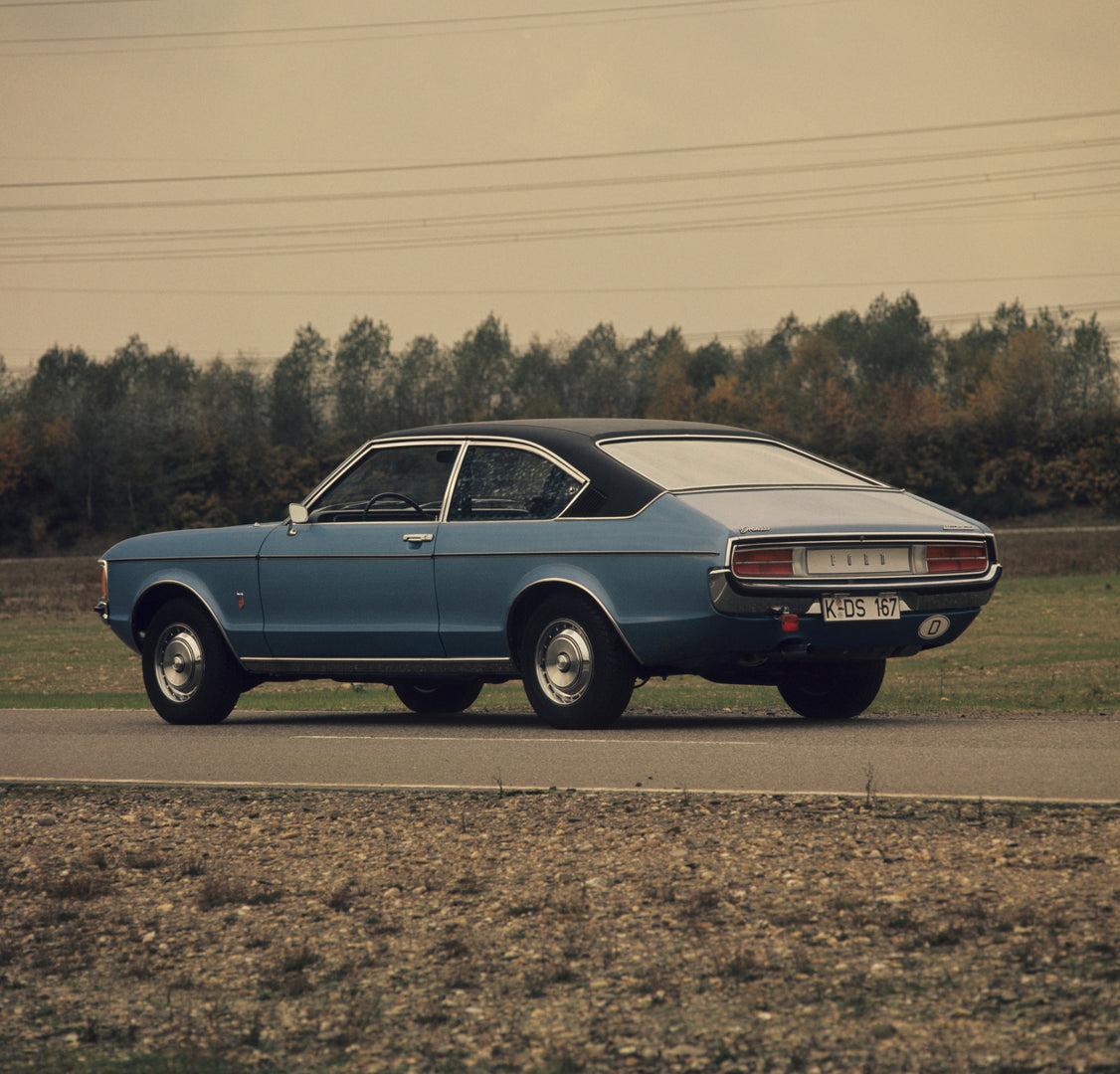 This archival image documents the 1974 Ford Granada Mark I rear view on scenic road and is preserved in the Ford Heritage Vault as part of Ford Motor Company's historic photographic archive. Free for personal, non-commercial use. Ford Heritage Vau...