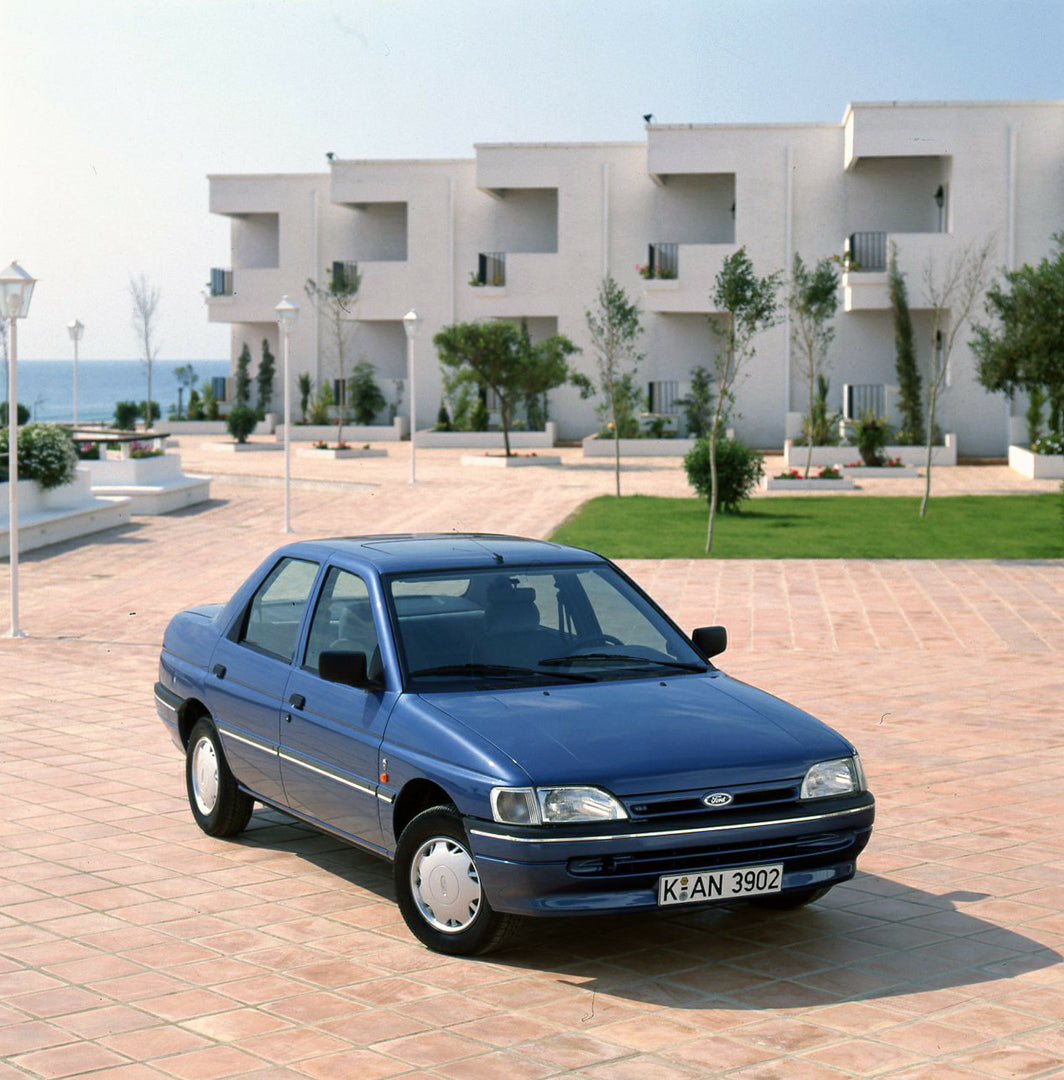 This archival image documents the 1990 Ford Orion Mark III near scenic building and is preserved in the Ford Heritage Vault as part of Ford Motor Company's historic photographic archive. Free for personal, non-commercial use. Ford Heritage Vault r...