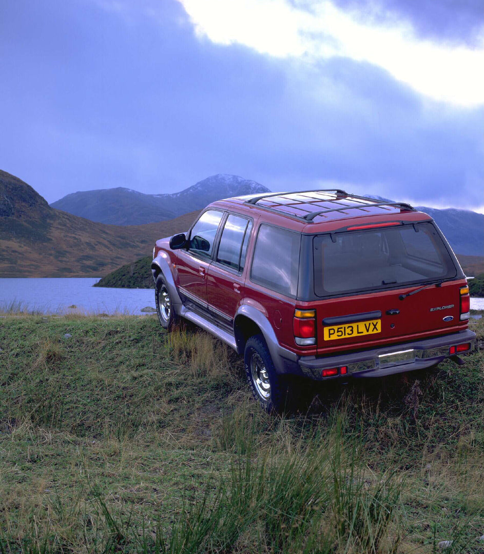 This archival image documents the 1996 Ford Explorer RHD rear view on scenic grassy hill AR-2002-213709 and is preserved in the Ford Heritage Vault as part of Ford Motor Company's historic photographic archive. Free for personal, non-commercial us...