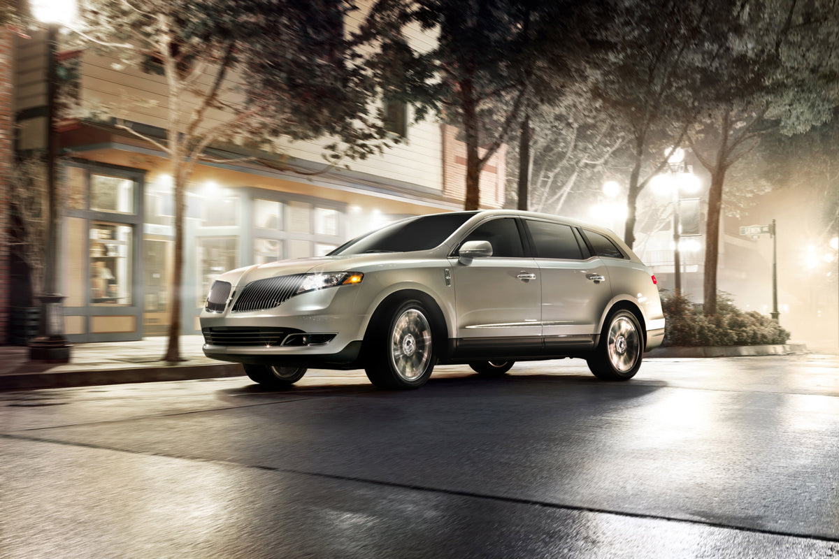 This archival image documents the 2013 Lincoln MKT action shot on city street at night MS4742 and is preserved in the Ford Heritage Vault as part of Ford Motor Company's historic photographic archive. Free for personal, non-commercial use. Ford He...