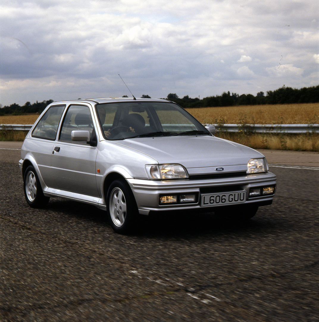 This archival image documents the 1993 Ford Fiesta Mark III XR2i action shot on scenic road and is preserved in the Ford Heritage Vault as part of Ford Motor Company's historic photographic archive. Free for personal, non-commercial use. Ford Heri...
