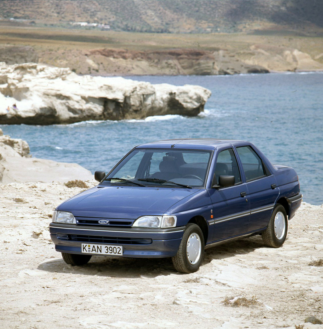 This archival image documents the 1990 Ford Orion Mark III near scenic ocean and is preserved in the Ford Heritage Vault as part of Ford Motor Company's historic photographic archive. Free for personal, non-commercial use. Ford Heritage Vault refe...