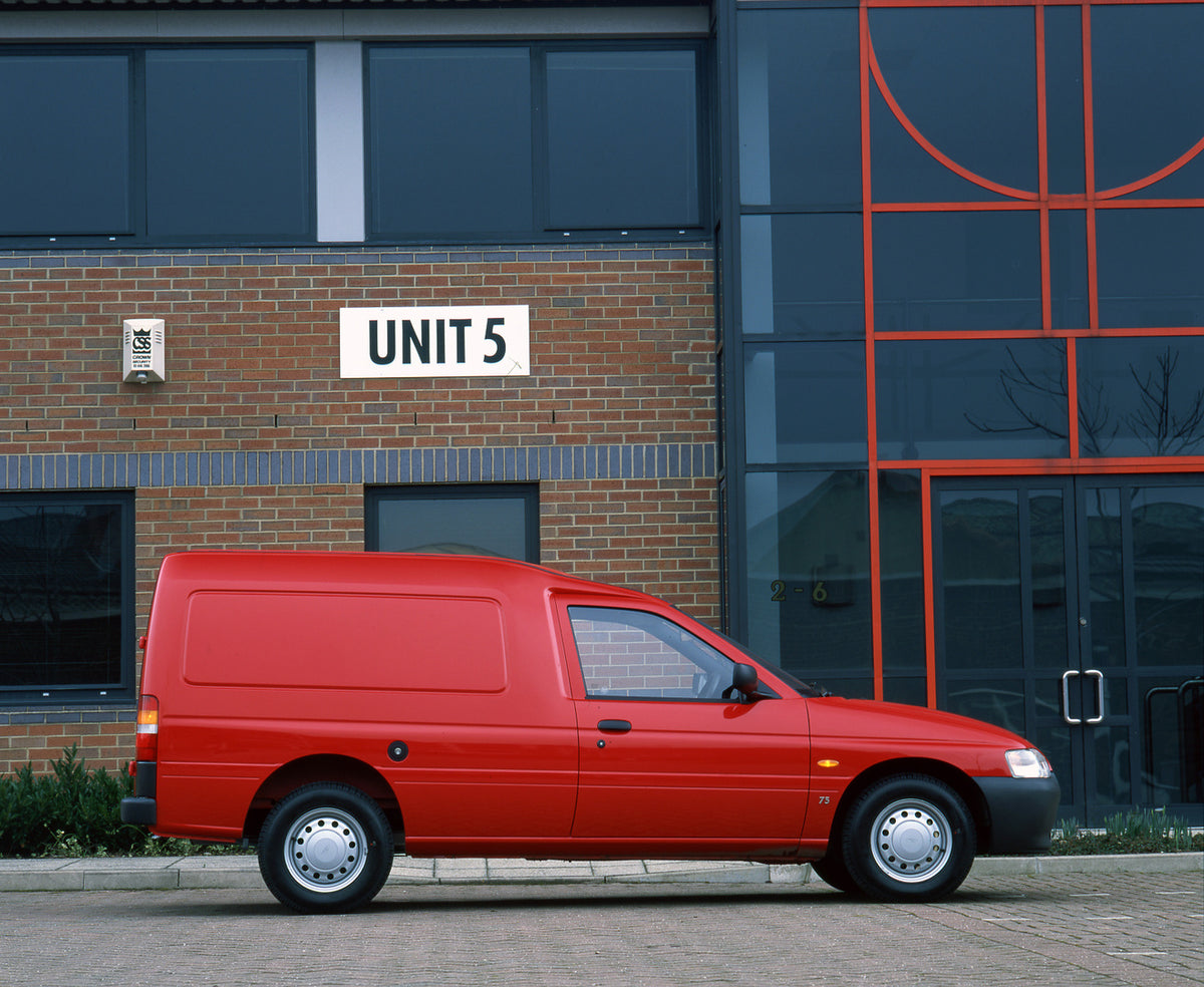 This archival image documents the 1995 Ford Escort Mark V Van side view in front of building and is preserved in the Ford Heritage Vault as part of Ford Motor Company's historic photographic archive. Free for personal, non-commercial use. Ford Her...