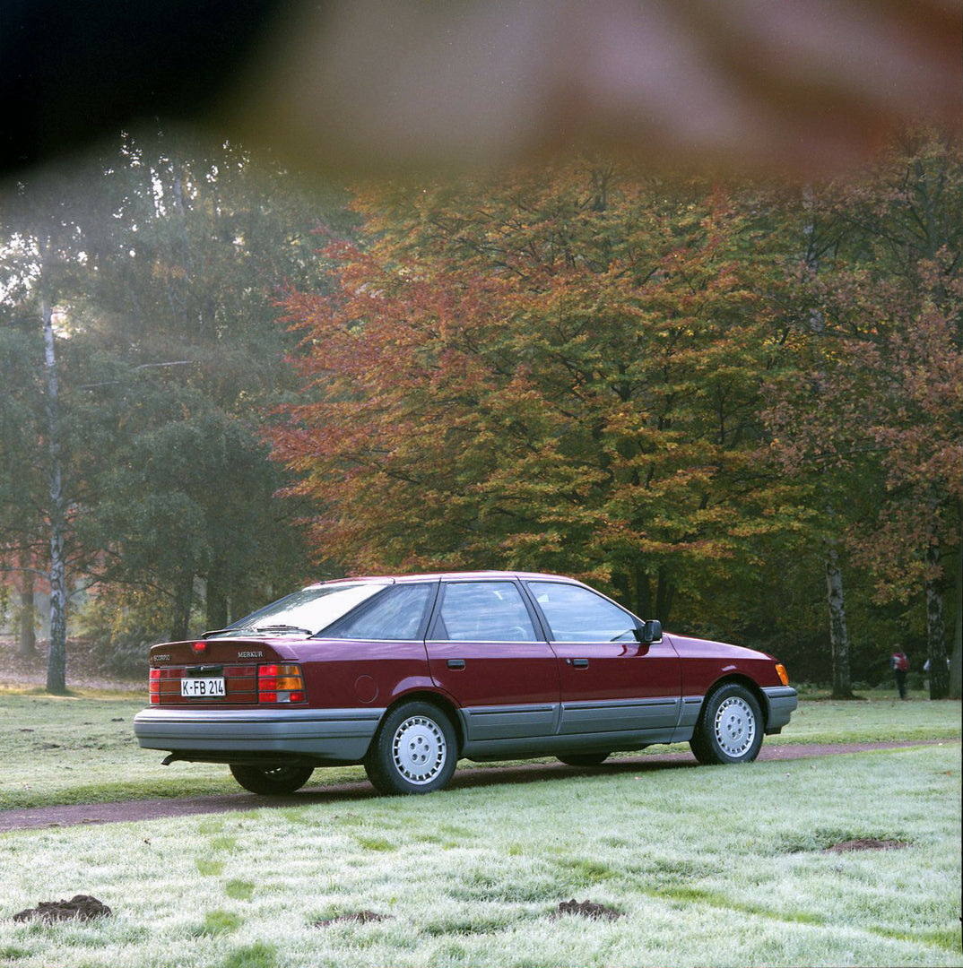 This archival image documents the 1986 Merkur Scorpio rear view with scenic trees in Cologne and is preserved in the Ford Heritage Vault as part of Ford Motor Company's historic photographic archive. Free for personal, non-commercial use. Ford Her...