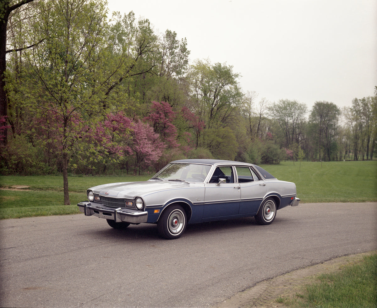 This archival image documents the 1976 Mercury Comet four-door with Trees in Background and is preserved in the Ford Heritage Vault as part of Ford Motor Company's historic photographic archive. Free for personal, non-commercial use. Ford Heritage...