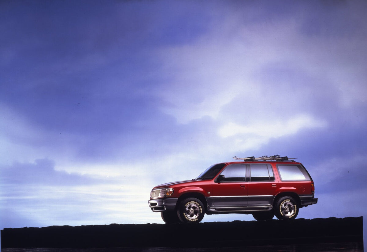 This archival image documents the 1997 Mercury Mountaineer side view with clouds in background CN325018-047 and is preserved in the Ford Heritage Vault as part of Ford Motor Company's historic photographic archive. Free for personal, non-commercia...