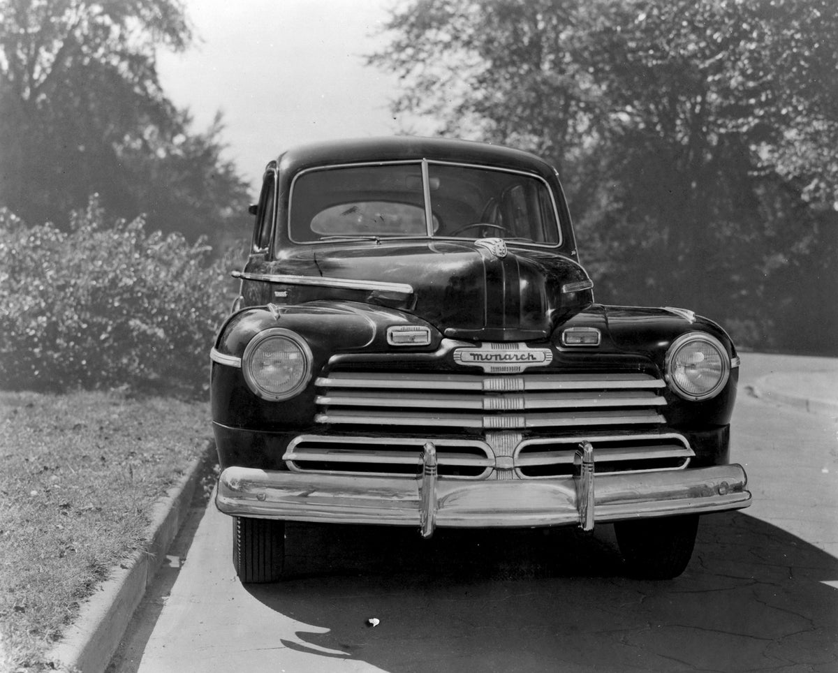 This archival image documents the 1946 Monarch Sedan front view on scenic road with trees AR-2007-5 and is preserved in the Ford Heritage Vault as part of Ford Motor Company's historic photographic archive. Free for personal, non-commercial use. F...