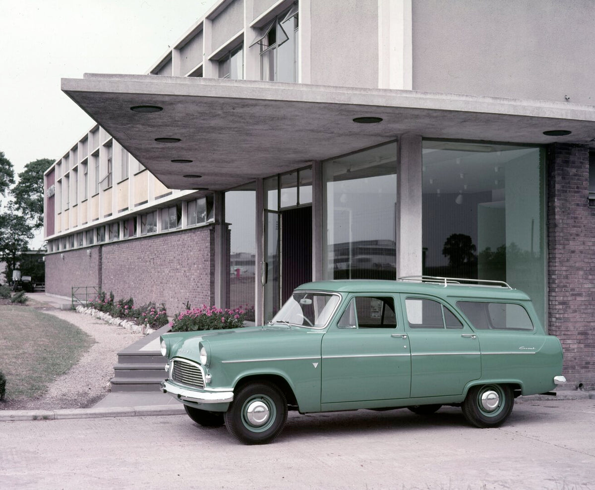 This archival image documents the 1965 Ford Consul Mark II Estate Car side view in front of scenic office building and is preserved in the Ford Heritage Vault as part of Ford Motor Company's historic photographic archive. Free for personal, non-co...