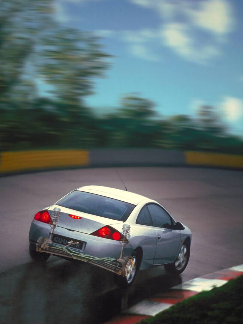 This archival image documents the 1998 Ford Cougar rear view action shot showing rear axle AR-2002-213709 and is preserved in the Ford Heritage Vault as part of Ford Motor Company's historic photographic archive. Free for personal, non-commercial ...
