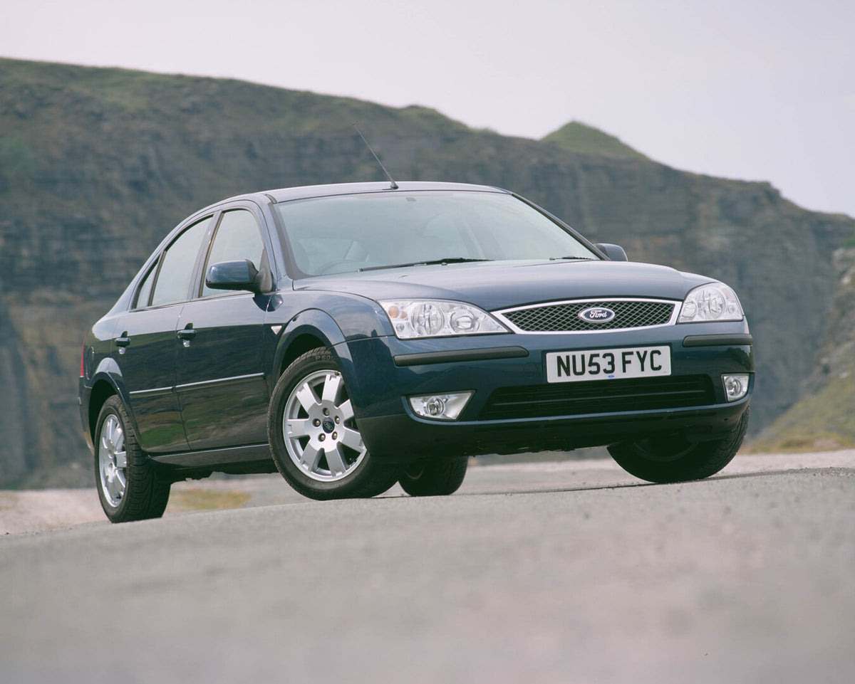 This archival image documents the 2003 Ford Mondeo Mark II on scenic road with mountains and is preserved in the Ford Heritage Vault as part of Ford Motor Company's historic photographic archive. Free for personal, non-commercial use. Ford Heritag...