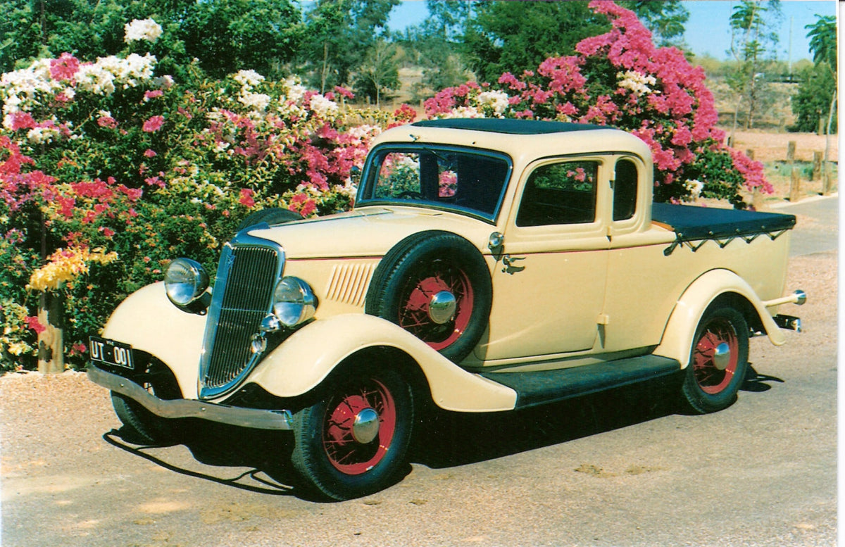 This archival image documents the 1934 Ford Model 40 Ute on scenic road with flowers and is preserved in the Ford Heritage Vault as part of Ford Motor Company's historic photographic archive. Free for personal, non-commercial use. Ford Heritage Va...