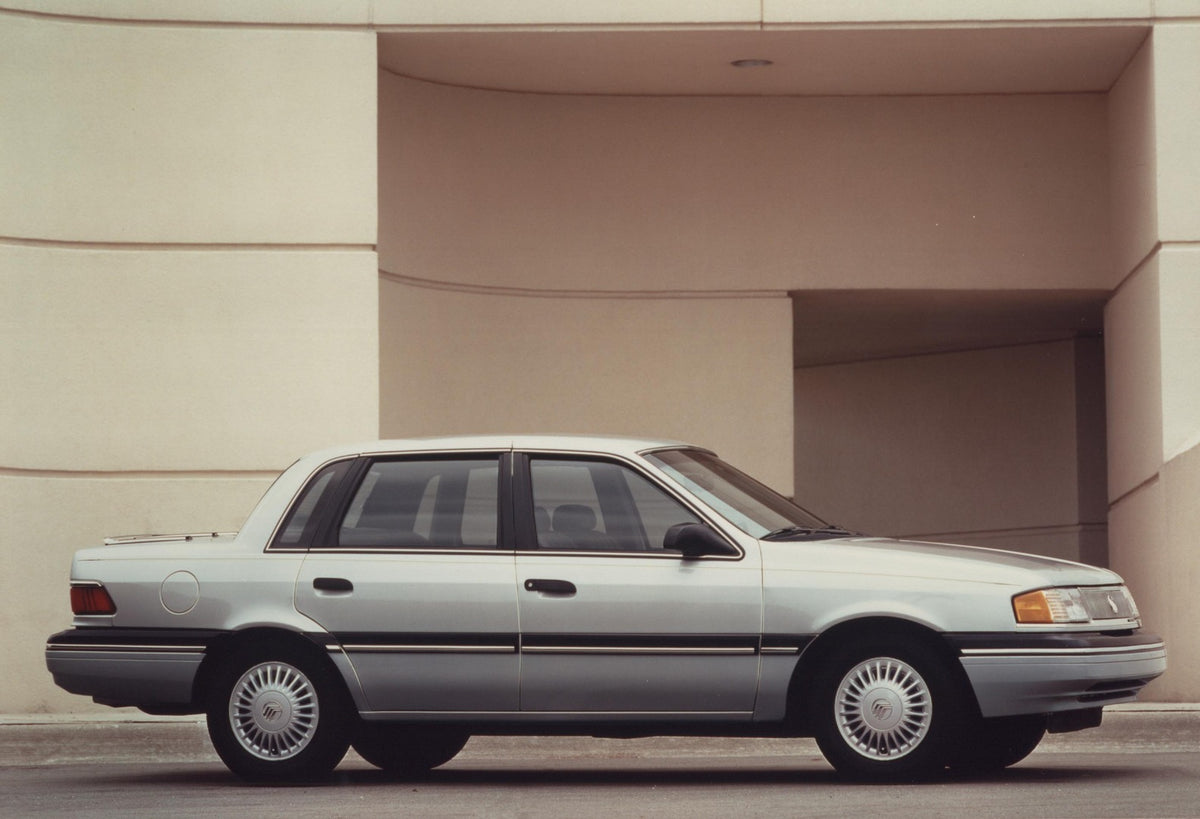 This archival image documents the 1991 Mercury Topaz side view AR-97-213544 and is preserved in the Ford Heritage Vault as part of Ford Motor Company's historic photographic archive. Free for personal, non-commercial use. Ford Heritage Vault refer...