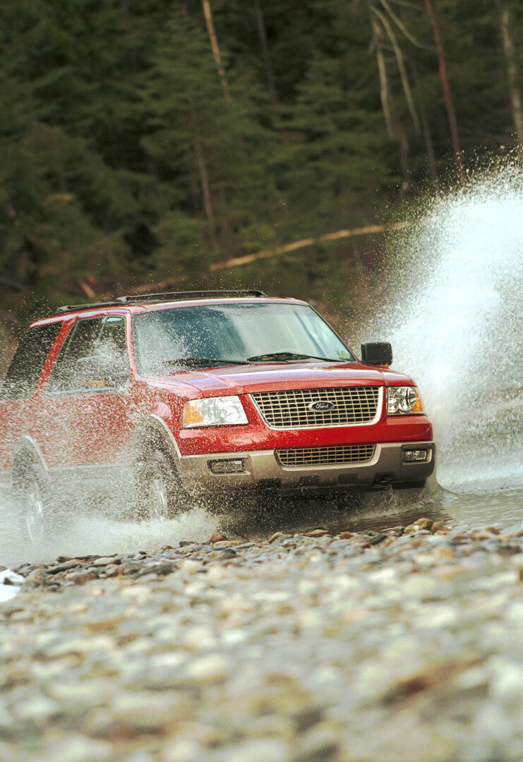 This archival image documents the 2003 Ford Expedition driving through water and is preserved in the Ford Heritage Vault as part of Ford Motor Company's historic photographic archive. Free for personal, non-commercial use. Ford Heritage Vault refe...
