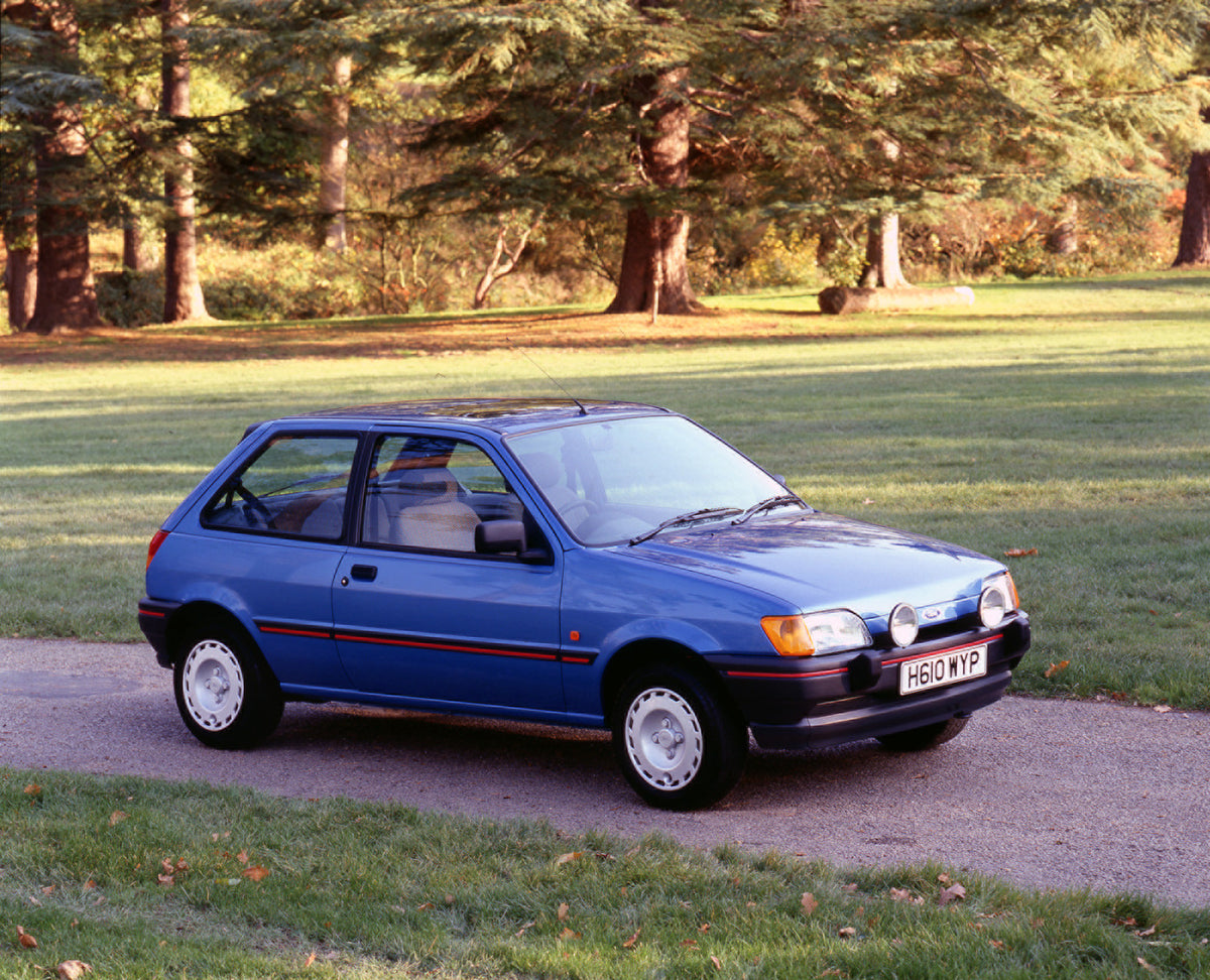 This archival image documents the 1990 Ford Fiesta Mark III S on scenic path with trees and is preserved in the Ford Heritage Vault as part of Ford Motor Company's historic photographic archive. Free for personal, non-commercial use. Ford Heritage...