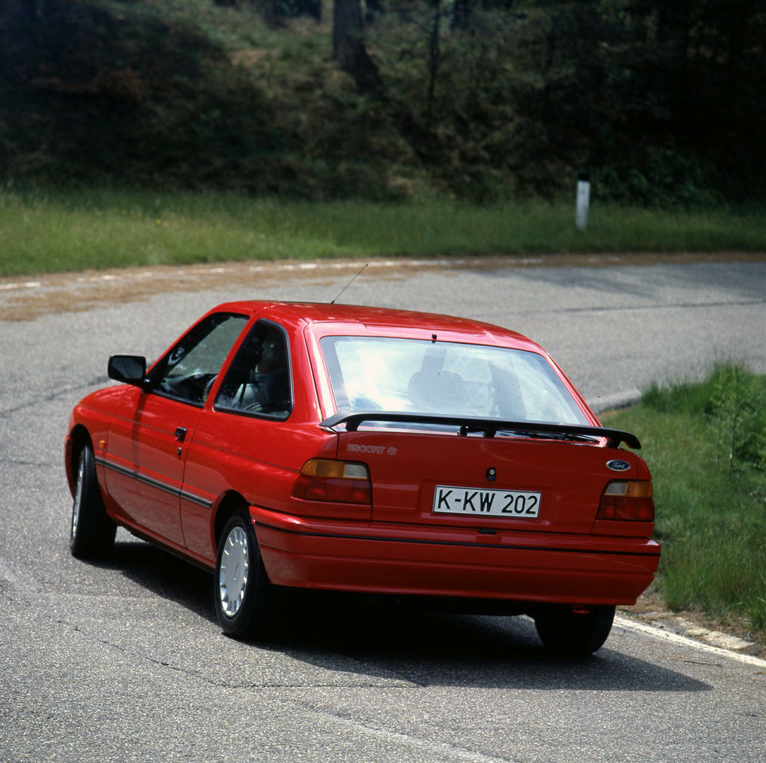 This archival image documents the 1990 Ford Escort S Mark IV on road in Lommel, Belgium and is preserved in the Ford Heritage Vault as part of Ford Motor Company's historic photographic archive. Free for personal, non-commercial use. Ford Heritage...