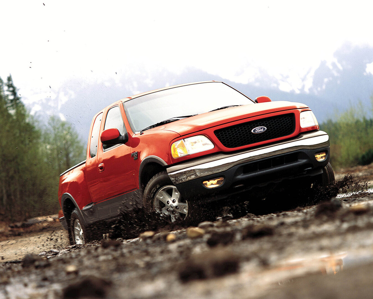 This archival image documents the 2003 Ford F-150 in mud and is preserved in the Ford Heritage Vault as part of Ford Motor Company's historic photographic archive. Free for personal, non-commercial use. Ford Heritage Vault reference AR-2008-8.1.2....