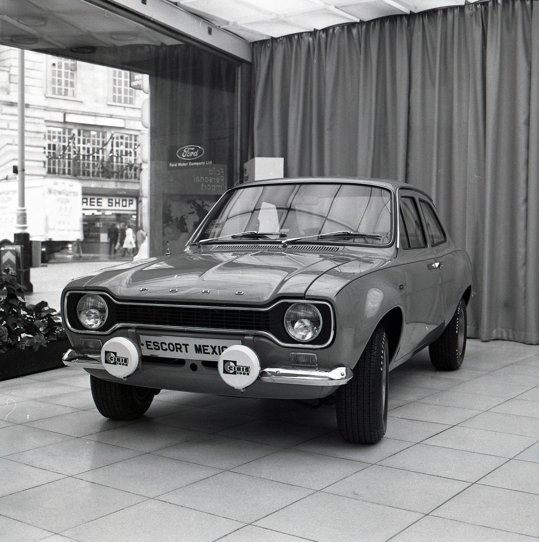 This archival image documents the 1972 Ford Escort Mexico MK1 in Regent Street Showroom and is preserved in the Ford Heritage Vault as part of Ford Motor Company's historic photographic archive. Free for personal, non-commercial use. Ford Heritage...