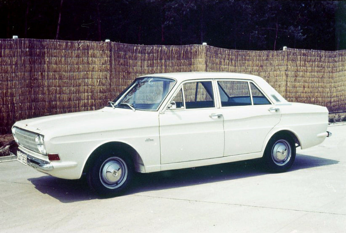 This archival image documents the 1962 Ford Taunus 12M in front of scenic fence and is preserved in the Ford Heritage Vault as part of Ford Motor Company's historic photographic archive. Free for personal, non-commercial use. Ford Heritage Vault r...
