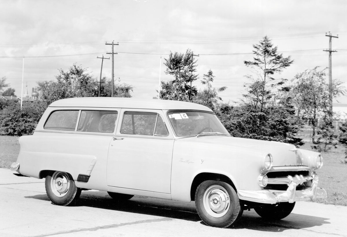 This archival image documents the 1952 Meteor Mainline Ranch Wagon on scenic road with trees and is preserved in the Ford Heritage Vault as part of Ford Motor Company's historic photographic archive. Free for personal, non-commercial use. Ford Her...