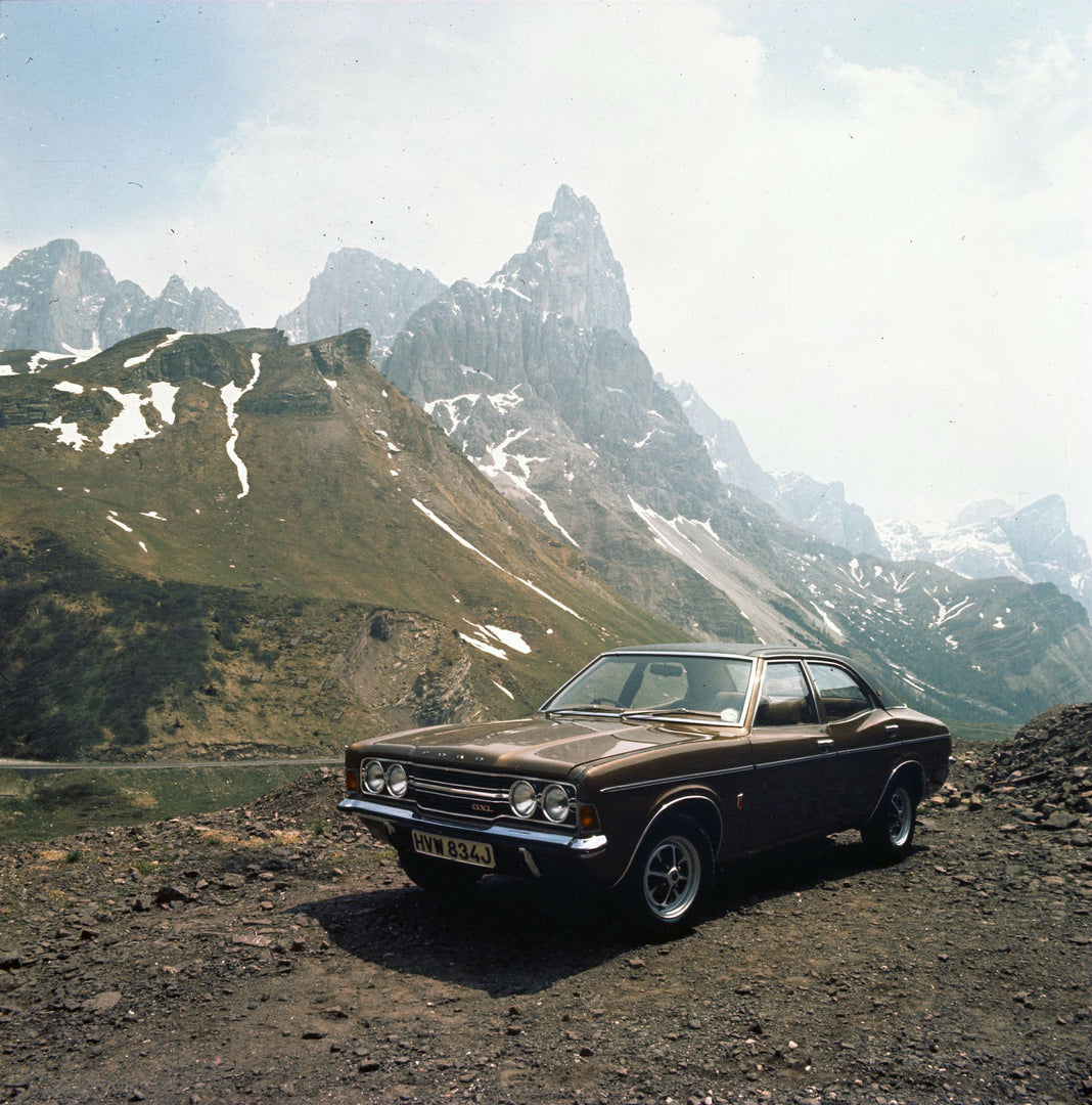 This archival image documents the 1970 Ford Taunus TC with scenic mountains in Italy and is preserved in the Ford Heritage Vault as part of Ford Motor Company's historic photographic archive. Free for personal, non-commercial use. Ford Heritage Va...