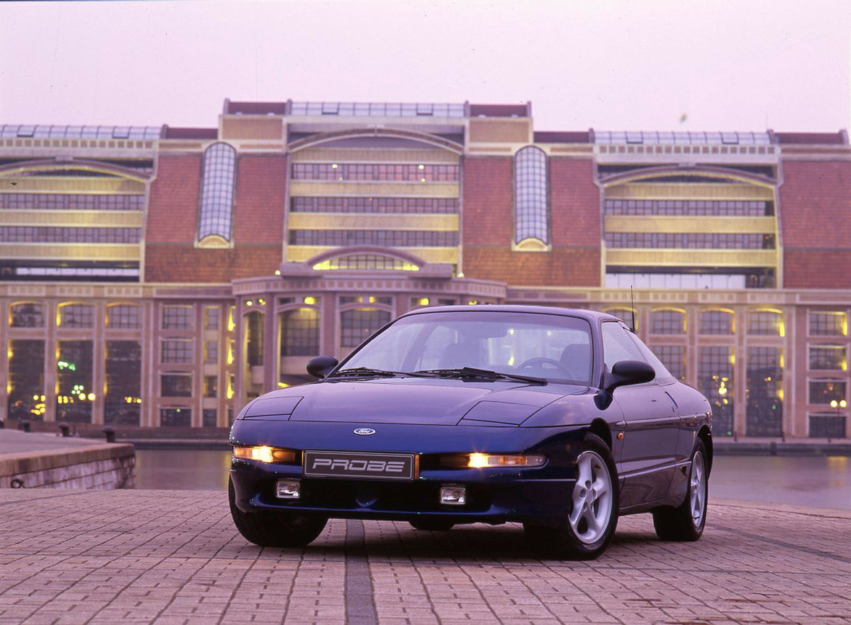 This archival image documents the 1993 Ford Probe in front of buildings in Dunkirk and is preserved in the Ford Heritage Vault as part of Ford Motor Company's historic photographic archive. Free for personal, non-commercial use. Ford Heritage Vaul...