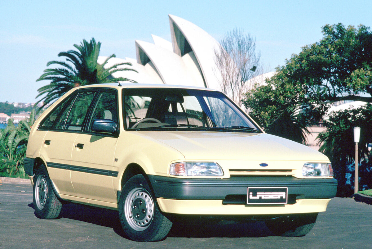 This archival image documents the 1988 Ford Laser GL with scenic trees and is preserved in the Ford Heritage Vault as part of Ford Motor Company's historic photographic archive. Free for personal, non-commercial use. Ford Heritage Vault reference ...