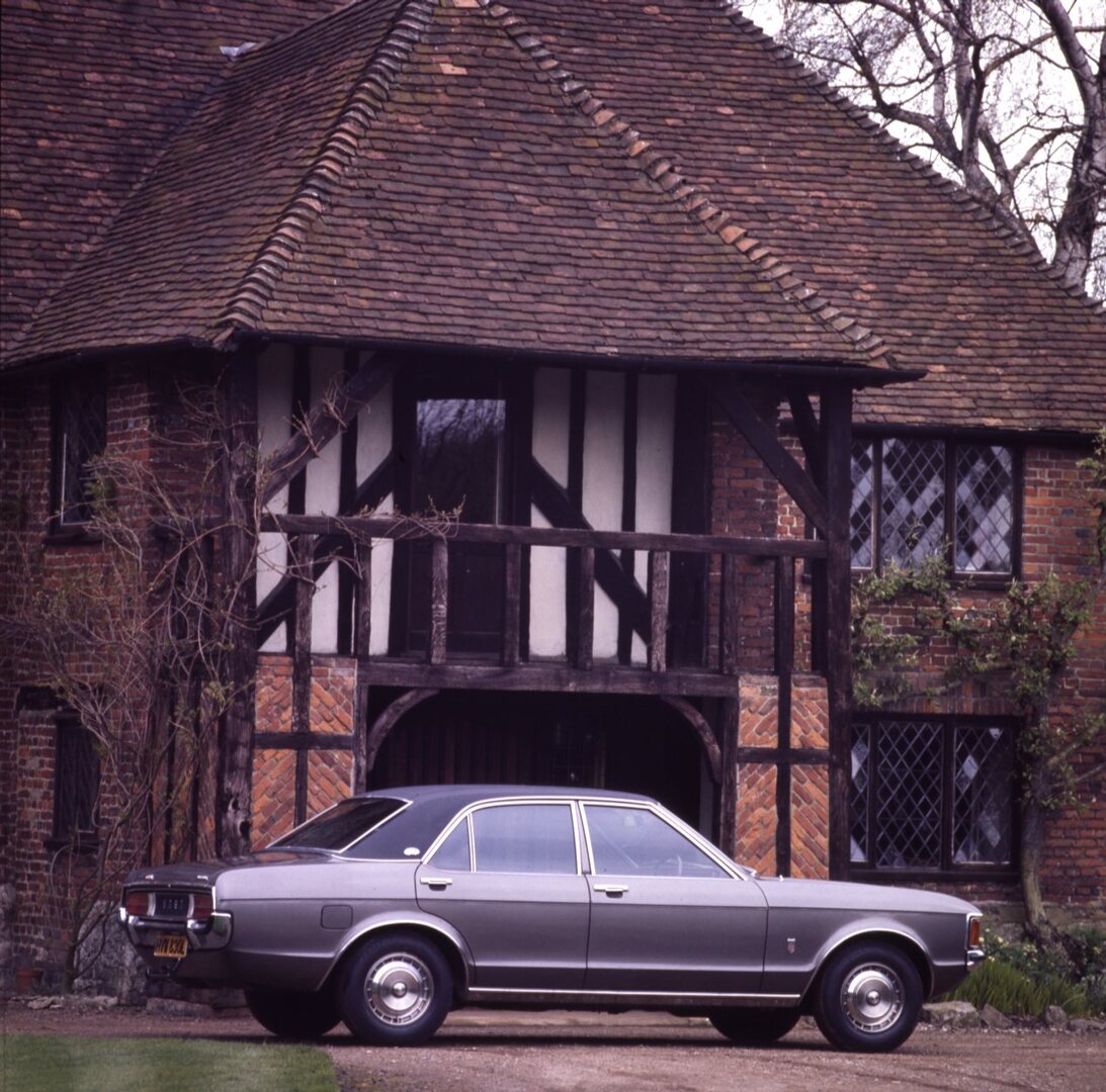 This archival image documents the 1972 Ford Granada Mark I GXL side view in front of scenic house and is preserved in the Ford Heritage Vault as part of Ford Motor Company's historic photographic archive. Free for personal, non-commercial use. For...