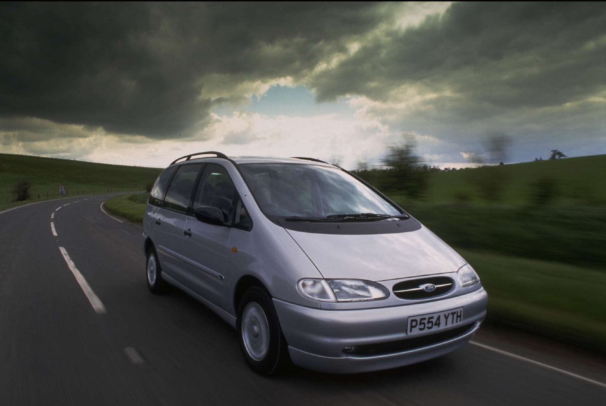 This archival image documents the 1996 Ford Galaxy Mark I Ghia action shot on scenic road AR-2002-213709 and is preserved in the Ford Heritage Vault as part of Ford Motor Company's historic photographic archive. Free for personal, non-commercial u...