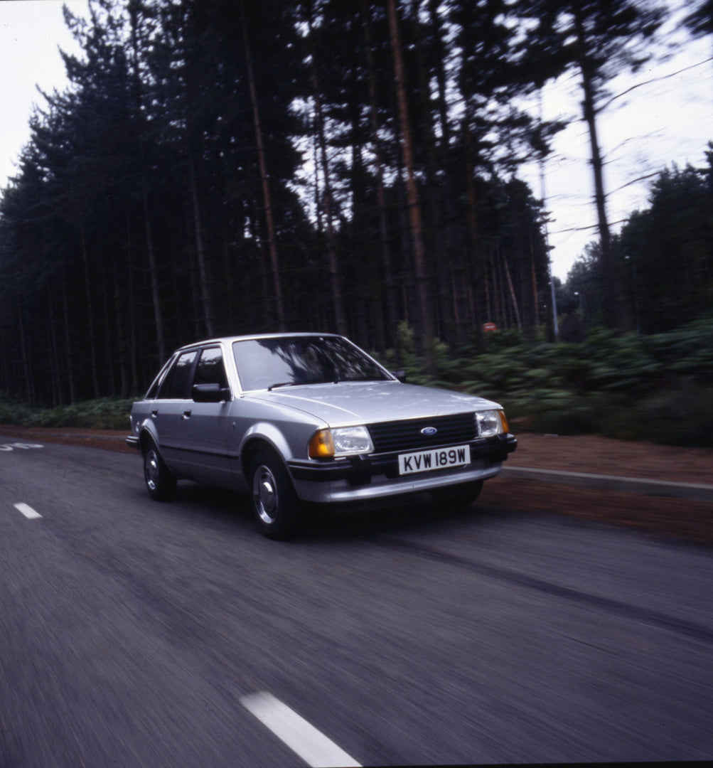 This archival image documents the 1980 Ford Escort Mark III front view action shot on forest road 1980-772002 and is preserved in the Ford Heritage Vault as part of Ford Motor Company's historic photographic archive. Free for personal, non-commerc...